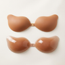 Silicone bra cups laid flat showing smooth adhesive backing