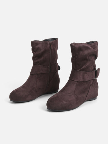 Rear view of slouched ankle boots showing heel height