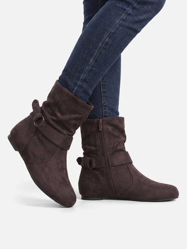 Ankle boots on a plain background, three-quarter angle