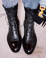 Sole and heel view of structured leather ankle boots