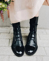 Back view of leather ankle boots showing heel and shaft
