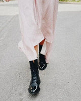 Leather ankle boots styled with straight-leg trousers