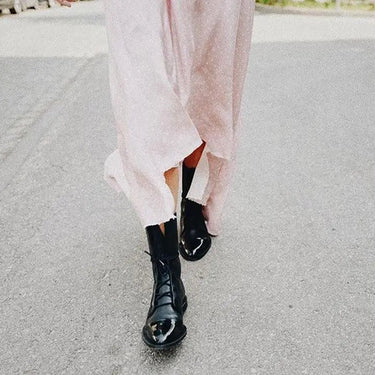 Leather ankle boots styled with straight-leg trousers