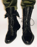 Close-up of the leather upper and toe cap of ankle boots