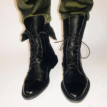 Close-up of the leather upper and toe cap of ankle boots