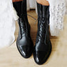 Leather ankle boots with lace-up front closure, side view