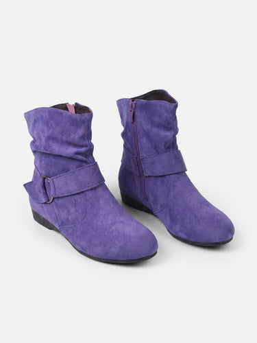 Close-up of adjustable buckle strap on suede-effect ankle boot