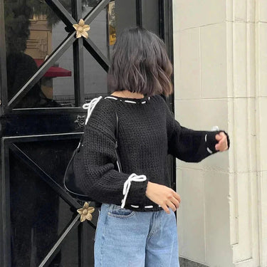 Full-length shot of the jumper styled with casual bottoms