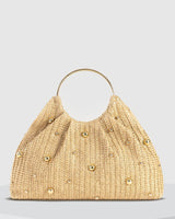 Top-down view of the beaded hobo bag highlighting the ring handle and woven texture