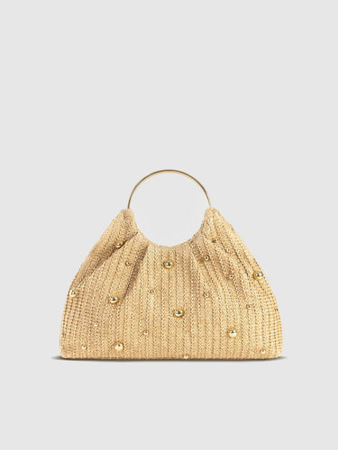 Front view of a woven straw hobo bag with metallic bead embellishments and a ring handle
