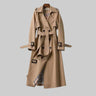 Front view of a longline double-breasted trench coat with self-tie belt and notch lapel