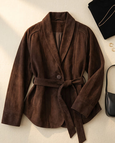 Full-length view of the suede belted jacket styled with straight-leg trousers