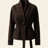 Front view of a belted suede jacket with wrap front and self-tie waist belt