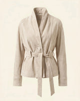 Side profile of a relaxed suede jacket showing natural drape and belt detail