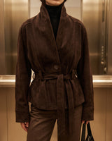 Back view of a belted suede jacket with relaxed silhouette