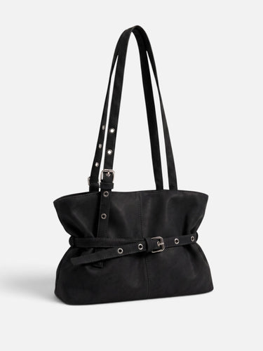 Side view showing the billowing shape and long shoulder handles of the tote bag