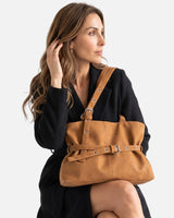 Top view of the open zip-fastened lined interior of the tote bag