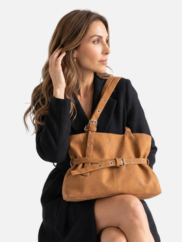Top view of the open zip-fastened lined interior of the tote bag