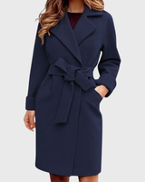 Detail shot of the lapel collar and belted waist of the trench coat