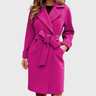 Front view of a belted long-sleeve trench coat with structured lapel collar