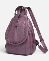 Side view showing the compact structured silhouette of the mini backpack