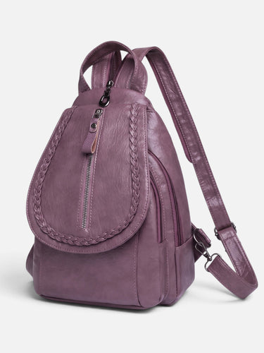 Side view showing the compact structured silhouette of the mini backpack