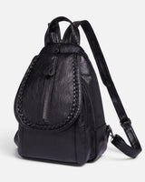 Front view of a structured mini backpack with braided flap trim