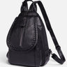 Front view of a structured mini backpack with braided flap trim