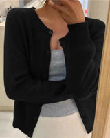 Side view showing the relaxed hip-length silhouette of the knit cardigan