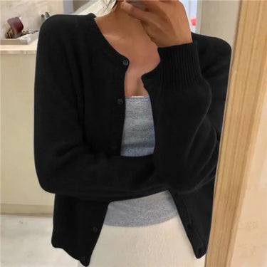 Side view showing the relaxed hip-length silhouette of the knit cardigan