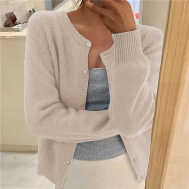 Detail shot of ribbed cuffs on a fine knit button-front cardigan