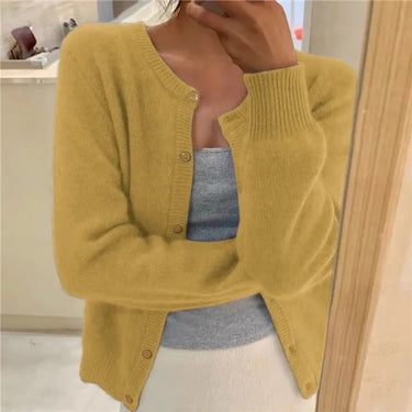 Styled shot of button-front cardigan worn fastened as a standalone top
