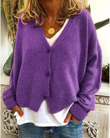 Side view showing hip length hem and relaxed silhouette of the cardigan