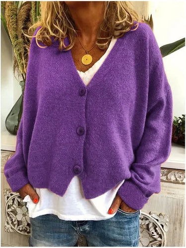 Side view showing hip length hem and relaxed silhouette of the cardigan