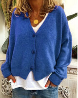 Detail shot of the even fine knit texture across the body of the cardigan