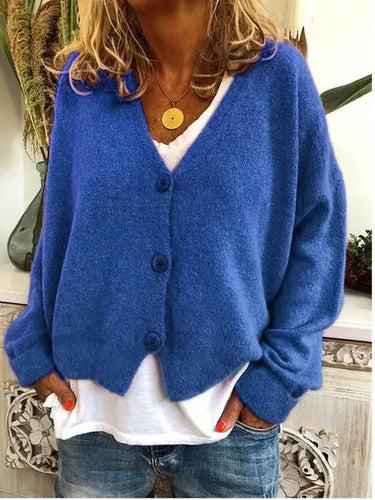 Detail shot of the even fine knit texture across the body of the cardigan