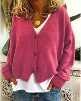 Cardigan worn fully buttoned, showing V-neckline and overall silhouette