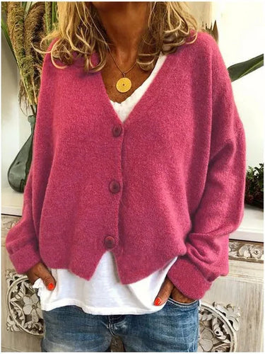 Cardigan worn fully buttoned, showing V-neckline and overall silhouette