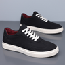 Men's low top trainer with lace-up closure and flat sole, side view