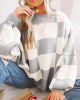 Model wearing the checked jumper in khaki styled with everyday clothing