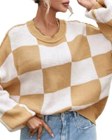 Close-up of the checked pattern detail on the jumper fabric