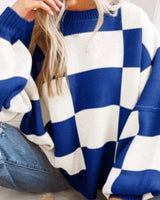 Close-up of the round neckline on the checked knitted jumper
