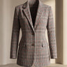Front view of a checked wool blazer with glen plaid pattern and notched lapels