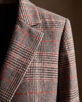 Close-up of the notched lapels and glen plaid weave detail