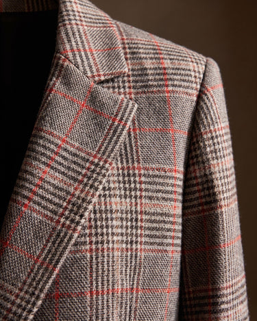 Close-up of the notched lapels and glen plaid weave detail