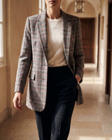 Three-quarter view of the checked wool blazer showing the full silhouette