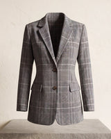 Side view showing the relaxed fit and hip-length cut of the checked wool blazer