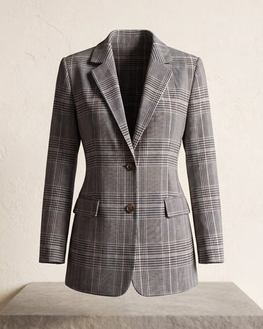 Side view showing the relaxed fit and hip-length cut of the checked wool blazer