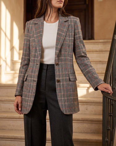 Flat lay of the checked wool blazer on a neutral background