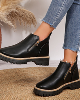 Side profile of ankle boot showing contrast stitching along the midsole